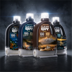Four bottles of Clean Guy 100 oil with scenic labels on a dark background