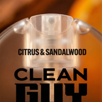 Clear perfume bottle with 'Citrus & Sandalwood' and 'Clean Guy' text on a blurred background