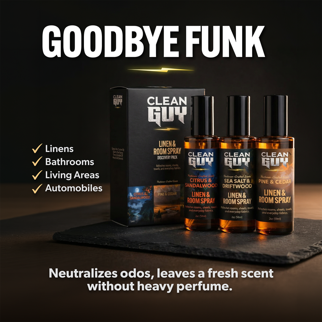 Clean Guy linen and room spray products with packaging on a dark surface.