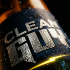 Close-up of a bottle with 'Clean Gut' label on a dark background