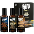 Three bottles of Clean Guy linen and room spray with packaging in the background.