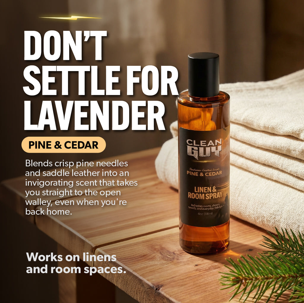 Bottle of Clean Guy Pine & Cedar linen and room spray on a wooden surface with text promoting the product.