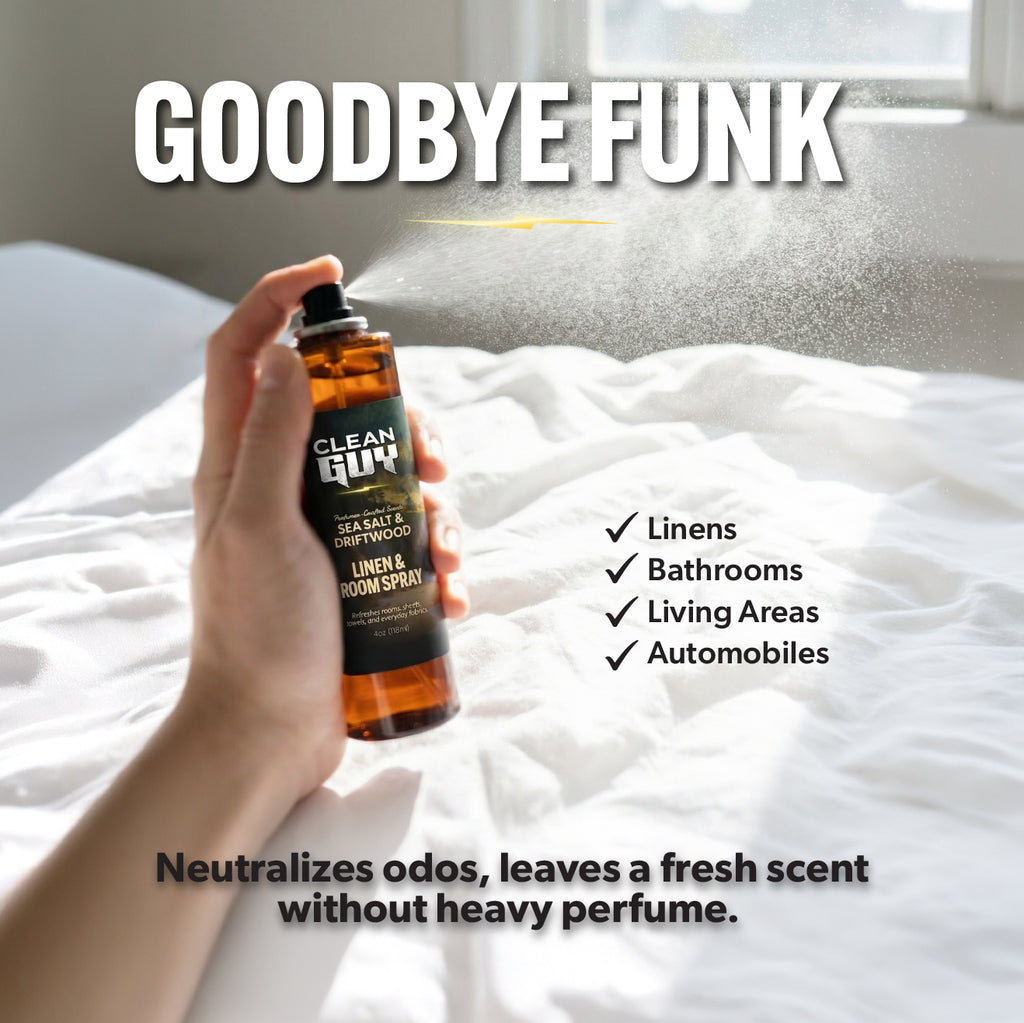 Hand holding a bottle of 'Clean Guy' linen and room spray on a bed with text about product uses and benefits.